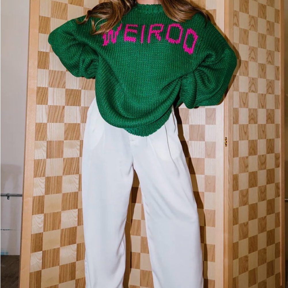 Dressed in LALA Green Sweater with Pink 'WEIRDO' Knit